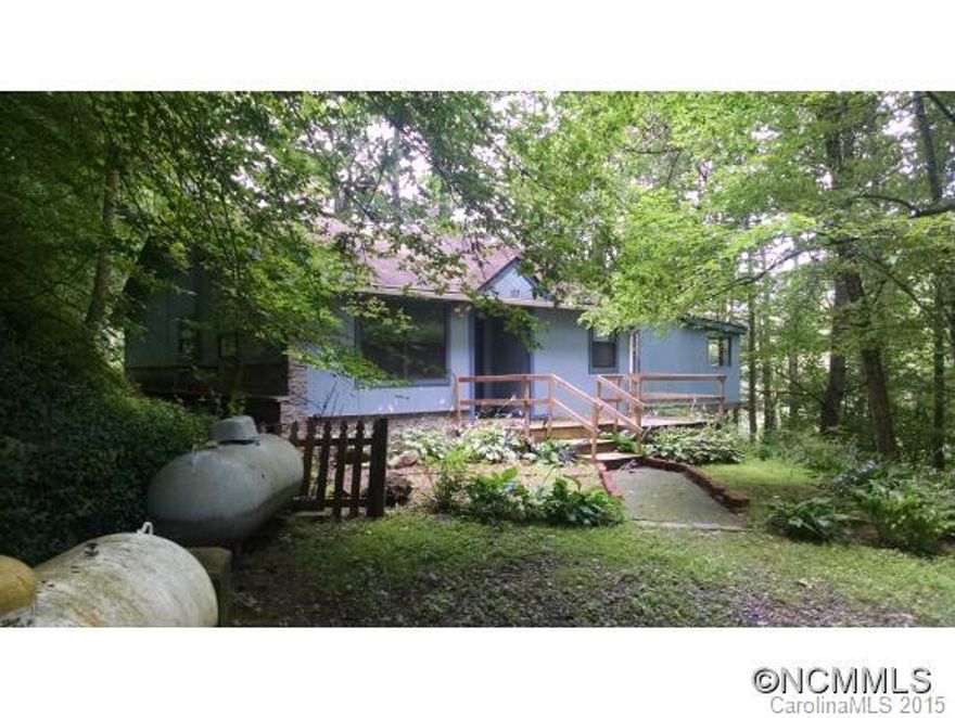 Charming cottage nestled in the woods. Enjoy all that nature has to offer from skiing Wolf Laurel to rafting the French Broad in this ideally located home. This is a Fannie Mae HomePath property. Sellers/Agents make no representations. Buyers/Agents advised to verify all info and perform all inspections. Info from public records.  All offers to be submitted through HomePath website.
