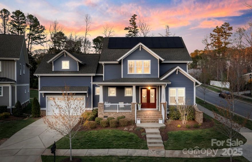 Beautiful custom home in popular Davidson Hall neighborhood located off Pine Rd. Rocking chair front porch, lush backyard (room for a pool) with screened in back porch and patio- across from the lg neighborhood green space. Primary bdrm on main level. Quartz counters, gourmet SS appliances & island. Addtnl downstairs bdrm with adjoining full bath & closet is currently used as an office. Custom window treatments, wallpaper throughout home and built in shelves in living room, lg walk in pantry & drop zone off garage. Upstairs you will find a gorgeous built in shelves in the spacious loft, 2 bdrms with ample sized closets & ensuite jack/jill baths. Massive bonus room is currently used as an extra bdrm/office space & has a full bath. Tons of closet space & storage in this home! Spacious laundry room is tucked in between levels. Solar panels on home almost completely pay for electric bill, with some months gaining a credit! EV charger outlet in garage. Move-in ready and immaculate!