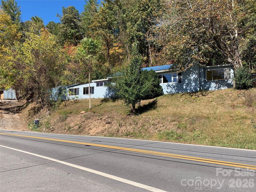 Owner/Broker property for sale "as is".  Property faces directly south and gets plenty of sunshine.  Enclosed garage recreation room has lots of possibilities as a game room and extra storage.  Great location close to Warren Wilson College and I-40.