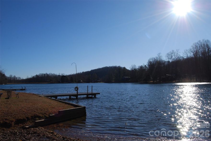 wooded lot off the lake but with lake rights for access septic permit obtained electric onsite community water available