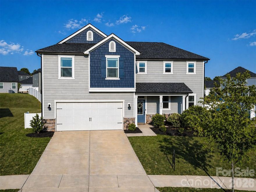 Welcome home to this 4-bed, 3.5-bath home in the sought-after Wilson Creek community in Indian Land. Perfectly positioned just minutes from downtown Waxhaw, Ballantyne, and Indian Land’s top-rated schools, this home also offers convenient access to shopping and dining, including the new Costco and Target at CrossRidge Center. Step inside to an inviting open floor plan with 9-foot ceilings, abundant natural light, and durable luxury vinyl plank flooring throughout the main living areas and stairs. The spacious kitchen is a true centerpiece, complete with stainless steel appliances, a gas range, 42-inch cabinetry, a large kitchen island, and a walk-in pantry. The main level also includes a private den with double French doors, a welcoming foyer, drop zone, laundry room, and a convenient powder room. The primary bedroom on the main floor provides a relaxing retreat with generous space and easy accessibility. Upstairs, you’ll find large secondary bedrooms, two full baths, and a versatile loft, perfect for a media room, play area, or home office. Enjoy outdoor living year-round with both covered front and rear porches, plus a large backyard featuring a hot tub. Additional highlights include an electric fireplace, insulated windows and doors, attractive fiber cement and stone exterior and a 2 car garage equipped with a Tesla charger for convenient at-home EV charging. Located in a vibrant new community, residents will enjoy amenities such as a pool, cabana, playground, and trails in the near future. This move-in ready home truly has it all in an unbeatable location. Don’t miss your opportunity - schedule a showing today!