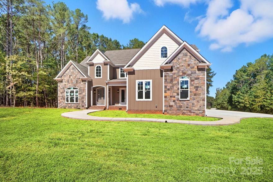 Stunning New Construction in Handsmill Lake Community! Welcome to your dream home. Nestled on a large, private, wooded lot surrounded by protected land that can not be developed, this brand-new custom-built residence offers the perfect blend of luxury, privacy, and natural beauty. Crafted by a highly sought-after custom builder, this home was thoughtfully designed with high-end finishes and an abundance of space. The gourmet kitchen is a true showstopper, featuring tons of custom cabinetry and an oversized walk-in pantry so spacious it functions as a second kitchen—perfect for entertaining or keeping the main space clutter-free. The main-level primary suite offers convenience and comfort, while upstairs you’ll find four additional oversized bedrooms, each with generous closet space. There’s also a dedicated first-floor office, ideal for remote work or a quiet retreat. Enjoy peaceful mornings and relaxing evenings on both your covered front and back porches, overlooking serene, wooded surroundings. The spacious 3-car garage offers ample storage and room for all your vehicles or hobbies. 
Located in a desirable lake community, you’ll enjoy access to water recreation, scenic views, and a tranquil lifestyle.