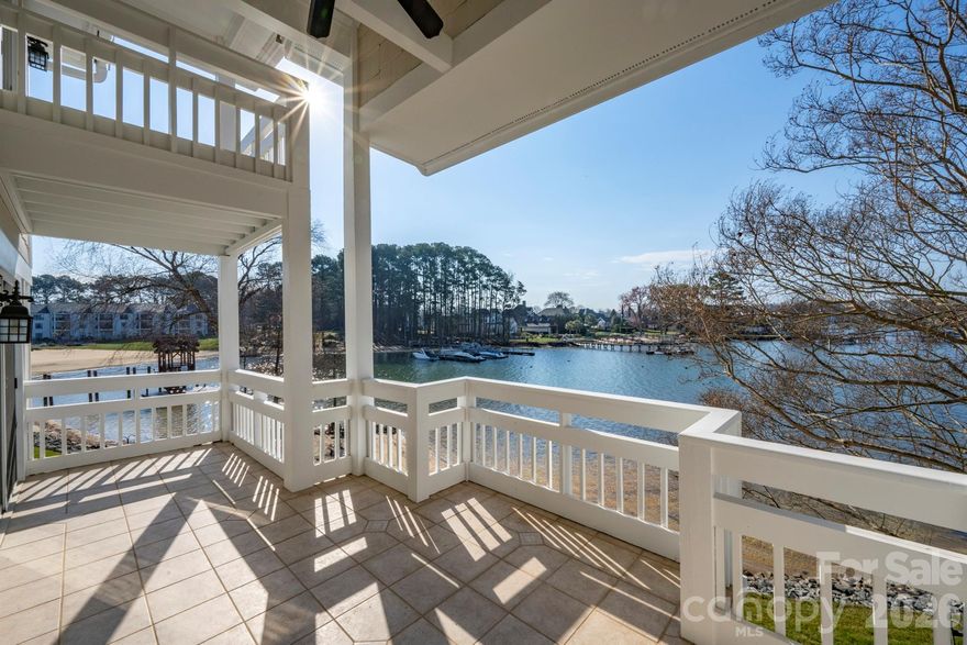 Fantastic waterfront opportunity on Lake Norman in the highly desirable community of Biscayne/Kings Point!  This END UNIT two-story condo has 3 bedrooms/3 full baths and stunning long range, year round water views.  Similar renovated floor plans have sold for well over $1M in Cornelius.  At just over 2,000 sq ft, there is plenty room to spread out including use of a dedicated dining room, 2 story great room w/gas log fireplace and an upstairs loft/office space that's perfect for multiple purposes.  Other great features include dual primary suites that face the lake with ensuite baths upstairs and on the main level and include their own balcony's.  Two of the three bathrooms have been updated, built in shelving included in the great room and in many of the closets and the high quality kitchen cabinets are soft close.  Additional storage space is located near the front door and on the back patio. Enjoy swimming at the lakefront community pool after a long day out on the boat or take in a game of tennis/pickleball.  Easy walking distance to Safe Harbor Kings Point Marina to get your boat out.  Don't have a boat, no worries!  Boat club's are also an option and located at the marina.  Close to Birkdale Village, restaurants/bars, greenways, major highways and the airport.  The only thing missing is you!