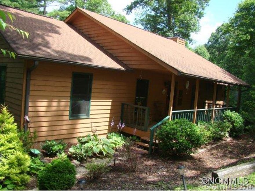 AWESOME VALUE! LOWEST PRICED HOME IN DESIRABLE, GATED COMMUNITY! Private cabin in the woods feeling with open floor plan. Wonderful screened porch with winter views, rocking chair front porch and covered patio. Main level Master suite has sitting area with fireplace, jetted tub, double sinks and separate shower. Full, unfinished basement suitable for expansion. Homeowners park with walking trail. Less than 15 minutes to downtown Asheville.