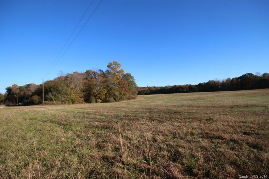 This 5 acres tract has open space and has beautiful hardwoods. A unique opportunity to own a piece of history. Originally 130 acre farm divided into 13 lots  from 3.3 to approx 25 acres and each tract is unique with the ambiance of country living, yet minutes from Lake Wylie shopping (6 miles). No HOA, no HOA dues, minimum restrictions. Clover Schools. Build when you want.