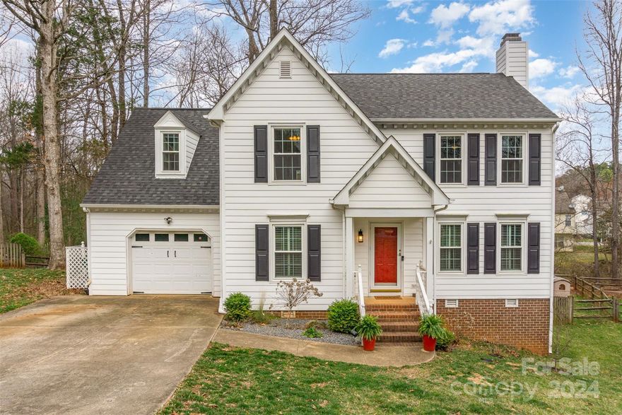 Davis Lake is a community that you will love calling HOME!   This beautiful home features wood floors and many tasteful upgrades - especially in the kitchen.  The exterior vinyl siding was added just a couple of years ago.  A convenient neighborhood walking trail is just on the other side of your fenced backyard which boasts several mature trees and plants.  The enormous attic spans the entire length of the house and could be finished into a wonderful bonus room or additional living space.   You will want to snuggle by the cozy wood-burning fireplace on one of those cold winter nights!   Both the AC and Furnace were newly installed in January 2024.  The HOA fee includes use of the pool, tennis courts, fitness center and clubhouse.  Come see what other perks this charming home and community have to offer!  Please note the dining room chandelier, refrigerator, washer/dryer and 2 Japanese maple trees outside do not convey.