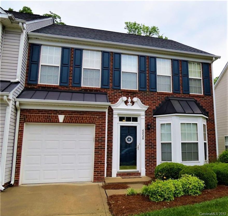 END UNIT with a garage! Stunning unit in highly desirable Harrisburg Town Center. This beautiful home is a MUST SEE. Lots of upgrades: granite counter tops, french doors leading to master, pre-wired for surround sound, updated light fixtures, canned lighting, new roof...etc. Home backs up to woods for a more private feel. Seller just had HVAC serviced.HOAs are $224/mth which include water, sewer, trash, and all yard maintenance. Close to shopping, recreation, restaurants, and the University.