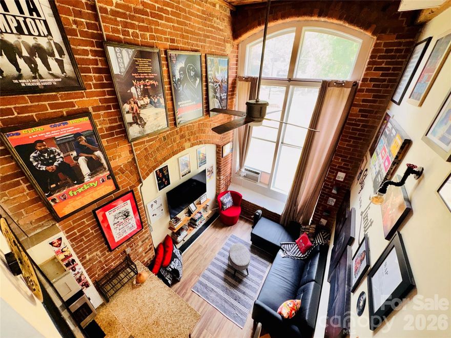 Discover your artistic haven in this beautifully restored historic mill condo, located just minutes from the vibrant heart of Uptown Charlotte! This charming one-bedroom loft perfectly balances vintage character with modern convenience, offering a blank canvas that eagerly awaits your personal touch.

Stepping inside, you are greeted by an expansive, two-story Great Room anchored by stunning exposed brick walls that infuse the space with a chic, industrial aesthetic. Whether you are an artist looking for inspiration or an urbanite craving a unique sanctuary, this cozy, light-filled loft delivers.

*Property Highlights*

Historic Charm & Character: 
Authentic exposed brick walls and soaring ceilings create a unique vintage atmosphere that celebrates the building's rich mill history.

Two-Story Great Room: 
A massive, open-concept living space perfect for entertaining, showcasing artwork, or simply relaxing in your private retreat.

Modern Kitchen: 
Fully equipped with sleek stainless steel appliances, ample cabinetry, and a stylish breakfast bar that makes meal prep and hosting a breeze.  

Lofted Bedroom Sanctuary: 
Ascend the elegant staircase to your private sleeping quarters, offering a picturesque, birds-eye view of the expansive living area below.

Unbeatable Location: 
Enjoy the best of Queen City living! You are just a stone’s throw away from bustling markets, trendy cafes, renowned museums, theaters, and all the cultural excitement Uptown Charlotte has to offer.

Your Urban Oasis Awaits
Properties with this level of character and historic pedigree are a rare find. Don't miss your chance to call this artistic, historic loft your new home.