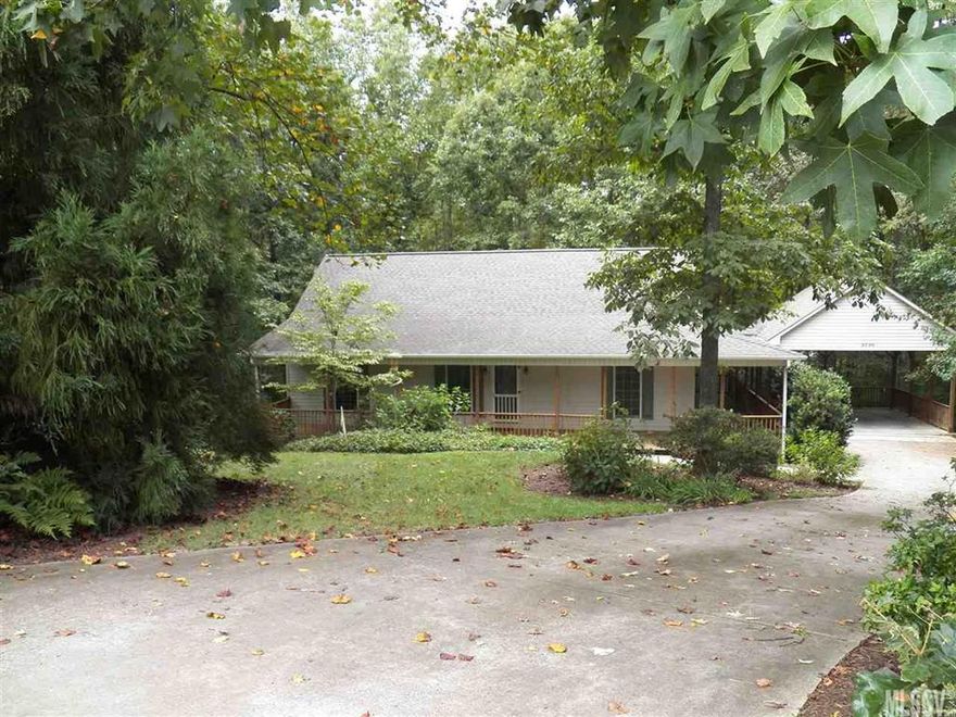 Lots of room in this 4BR/3BA rustic home in Hickory Woods.  Hardwoods throughout GR, DR, kitchen & bedrooms on main level.  Full basement with den, 2BR's & Jack-N-Jill bath.  Walk up attic, great for storage and work shop in basement.  Snow Creek runs through the back of the property.