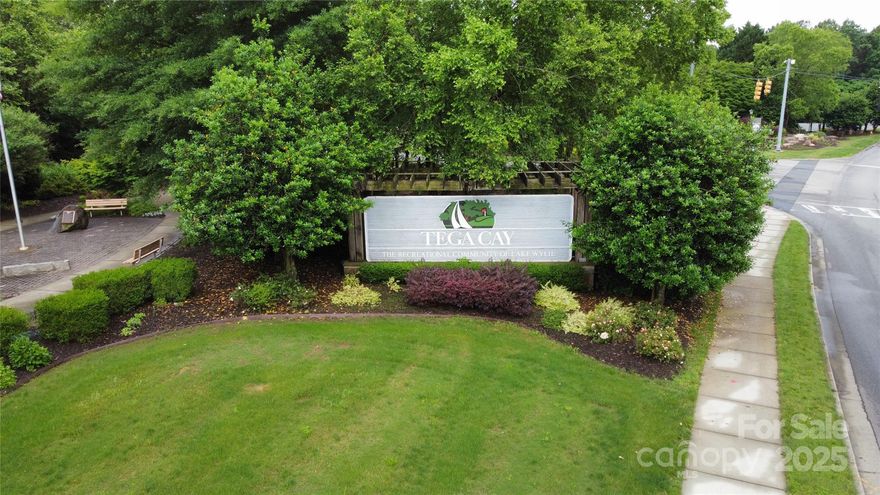 Explore this homesite to create your ideal home with your chosen builder. Positioned opposite the golf course and a short stroll from the Tega Cay community center, this lot offers an exceptional location. Tega Cay, renowned as one of the top places to reside in the Carolinas, is conveniently situated just minutes from I-77.