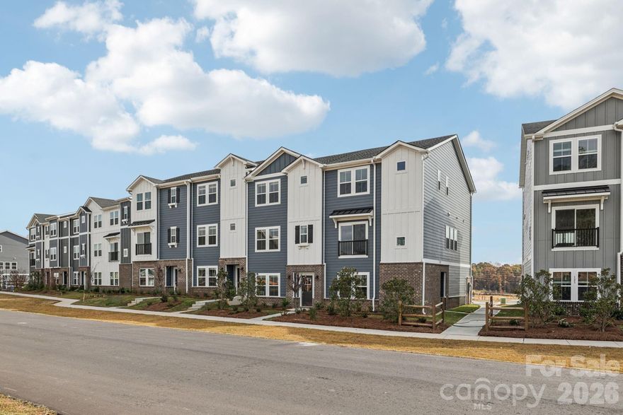 Brand new, energy-efficient home available NOW! The Pembrooke's first-level bedroom makes a great office or guest suite. A balcony on the main level extends living space outside. The third-floor primary suite boasts dual sinks and a large walk-in closet. New three-story townhomes in Fort Mill, SC bring lower-maintenance and energy-efficient features to the area. With our move-in ready homes, you will find a washer, dryer, fridge and whole-home blinds, guaranteed to close in 60 days or less. (You'll be reimbursed up to $5,000 in expenses related to delays we cause.) Relax in your private primary suite and enjoy the back balcony, all with easy access to Baxter Village and Uptown Charlotte.  Each of our homes is built with innovative, energy-efficient features designed to help you enjoy more savings, better health, real comfort and peace of mind.