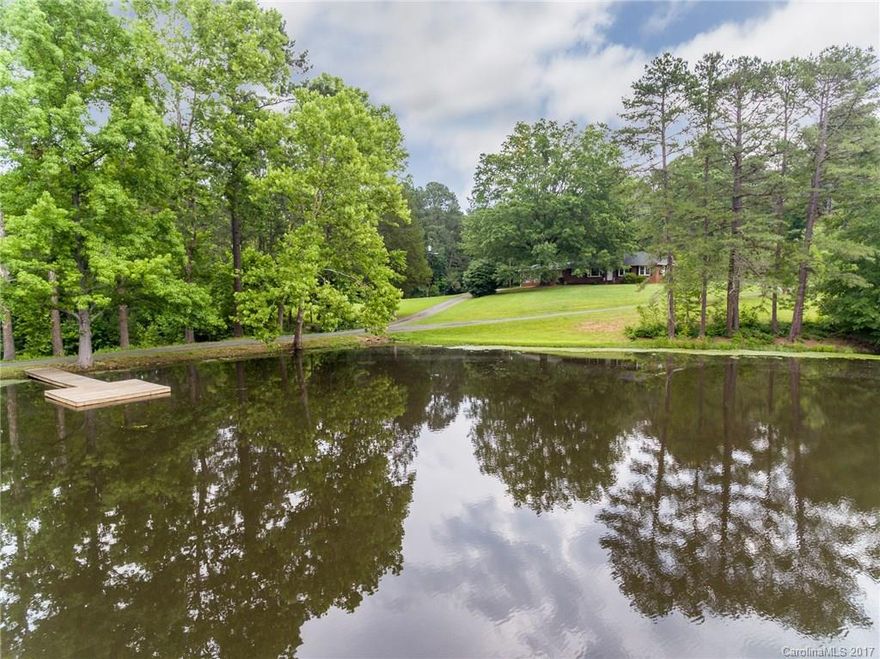 You will want to preview this  "one of a kind" property in Norwood. 3 BR, 2 BA w/ office, brick ranch located on ~43 acres.Original hardwoods, fireplace. Very well-maintained. Beautiful, peaceful setting with pond and fishing pier. There is also plenty of room for a garden. Home is convenient to Lake Tillery & public boat launch.