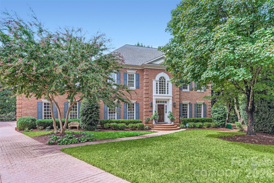 Welcome to 2560 Morrocroft Lane, a timeless full brick colonial located in the highly sought-after Villages of Morrocroft in the heart of SouthPark, one of Charlotte’s most prestigious and convenient areas. This 4-bedroom, 3.5-bath, 3 car garage residence blends classic architecture with thoughtful updates, offering both elegance and everyday comfort in an unbeatable location just minutes from SouthPark Mall, top-rated dining, and a short drive to Uptown Charlotte.

From the moment you arrive, the home’s stately curb appeal, manicured landscaping, and inviting entry set the tone for what awaits inside. Rich hardwood floors flow throughout the main living areas, complemented by detailed moldings and abundant natural light. The spacious living room, anchored by one of two fireplaces, creates a warm and refined gathering space, while the formal dining room offers the perfect setting for hosting.
The main-level primary suite is a standout feature, providing convenience and privacy. This generously sized retreat includes custom dual closets, built-in cabinetry, and a beautifully renovated en-suite bath with an oversized walk-in shower and high-end finishes. A dedicated office with its own fireplace offers an ideal work-from-home setup or quiet study.

Upstairs, additional bedrooms are well-proportioned, and a massive bonus/billiard room provides incredible flexibility—perfect for recreation, media, or a secondary living area. Outdoor living is equally impressive. Step into your private, garden-like setting with mature landscaping designed for both beauty and seclusion. Enjoy quiet mornings or relaxed evenings on the back porch, or explore the opportunity to create your own outdoor oasis—the current owner has already verified and designed a pool that could be installed, offering future potential to elevate the space even further.

Located just moments from SouthPark’s premier shopping, dining, and lifestyle amenities, 2560 Morrocroft Lane offers a rare combination of classic design, modern updates, and exceptional location. This is a home that delivers both presence and practicality in one of Charlotte’s most established communities.