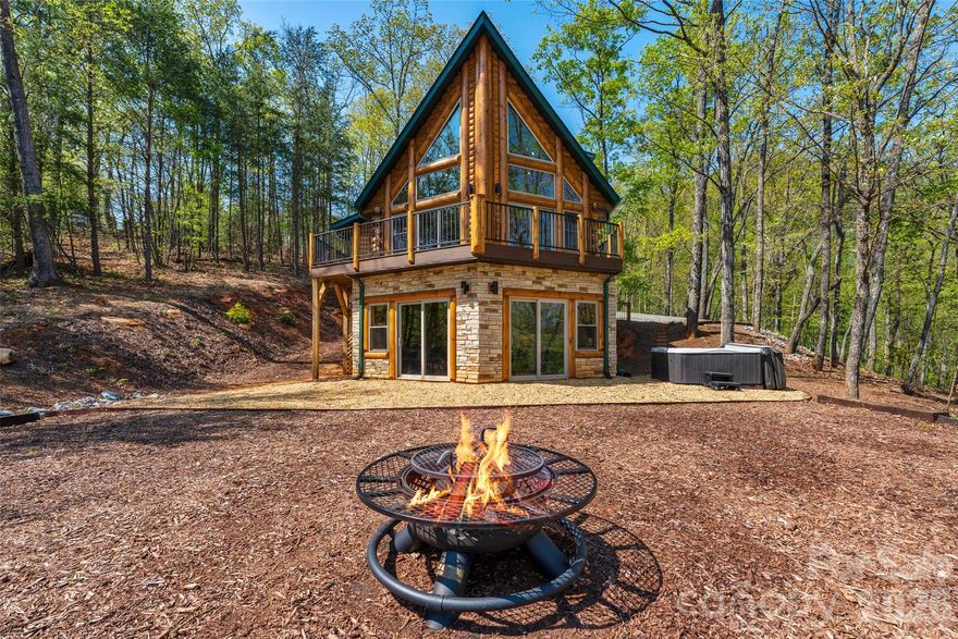 Lake Lure is coming back to life!  Welcome to this amazing, secluded luxury log cabin at Lake Lure! Like brand new, built in 2024, hardly lived in. Gorgeous mountain views from multiple levels on just over 2 acres, to relax, unwind, & enjoy your morning coffee or sunset relaxation after a long day. Partake in a soothing sauna or hot tub, or enjoy a nice meal in a gorgeous kitchen with an amazing view. Quartz counters, Maytag appliances, and LVP floors are featured throughout much of the home, along with high ceilings. Gorgeous log stairways throughout. The builder used Pella windows & 8" logs for their beauty & energy retention. There's also Rumbling Bald Resort, where you can partake in lake activities, a relaxing day of golf, pickleball, spa, fitness center, pools, restaurants, & much more, wherever the day takes you! Let this cozy home become your weekend getaway, vacation retreat, or primary residence.