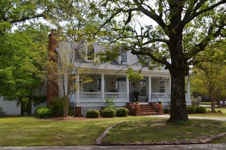 Timeless piece of history! This stunning historical home was built approximately in the 1890's w/ original hwds floors on the main so well maintiained as if they haven't aged a bit! Perfectly landscaped w/ exotic flowers that come from all over! Many architectural details, skylights, and dual climate control w/ diverter system. Huge mudroom for laundry w/ sink. Rocking chair porch, private patio, fenced, breezeway to garage, old barn and chicken coup on the edge of the property! Must see!