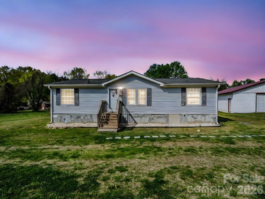 The perfect home if you're looking to be close to Highway 74 or Shelby! This gorgeous home is nestled on a perfectly clear one acre lot with room for animals, a garden or any other outdoor activity. This three bedroom and two bathroom home features gleaming hardwood floors and a spacious kitchen with beautiful solid oak cabinetry with pull-out shelves for convenience. The split bedroom plan offers privacy for families. A large 1320 square feet concrete building is adjacent and could be used for a business or storage organization.
