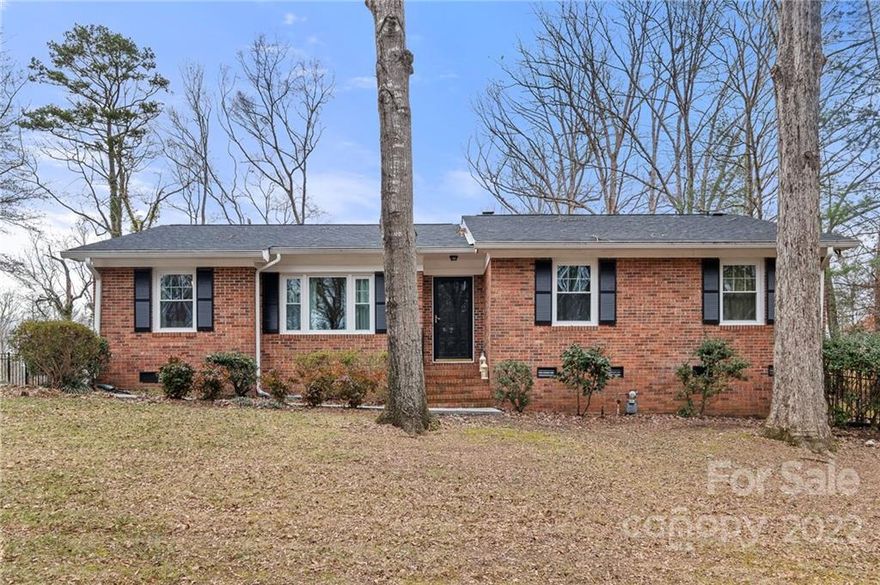 Inviting Full-Brick Ranch, situated on over half an acre, with a Fenced Backyard located in the desirable Arrowood subdivision. Directly off Foyer is a living room with beautiful hardwood wood floors and a large window to allow for abundant sunlight. Kitchen features smooth surface countertops, updated stainless steel appliances (2022), tile backsplash and nautical blue cabinets; with eat-in breakfast area or dine in the adjacent formal dining room. The freezer in the laundry room will convey. The roof and HVAC were replaced in 2021 and the windows in 2022; and there are new light fixtures throughout the house. Primary bedroom, bathroom, 2 additional bedrooms and an additional bath are all located on the main floor. Relax by the wood-burning fireplace in the den or have game night in the spacious family room. Enjoy the large fenced backyard and so much more. Hurry and see this charming home before it is gone!