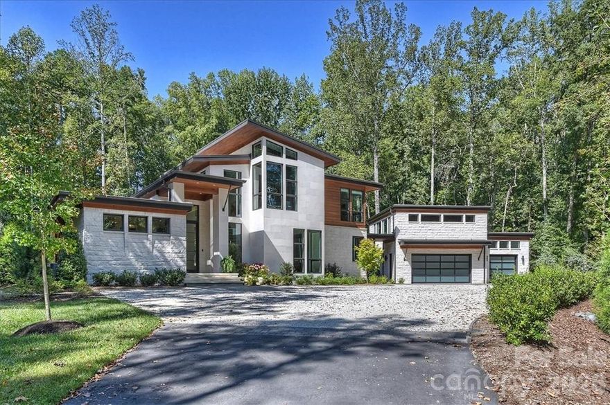 Experience the pinnacle of modern design combined with the highest standard in luxury living in this contemporary home that is beautifully integrated into a 2.5-acre wooded homesite. Featuring expansive windows, natural Texas limestone, and cypress (inside and out) to make it feel harmonious with its environment. The living space is designed to bring the “outside in” with multiple exterior views from any sitting position and a massive 14’w x 10’h sliding door in the main living space that disappears into the wall to create a seamless transition from indoor to outdoor living. The kitchen was designed with a romantic dinner or large dinner party in mind; featuring chef’s quality appliances and a 2500 bottle wine cellar visible from the main living areas through walls of glass. The view from the master bedroom suite is of the spa and water feature which makes you feel as though you are living an exclusive resort experience every day right here at home. Built in 2018.