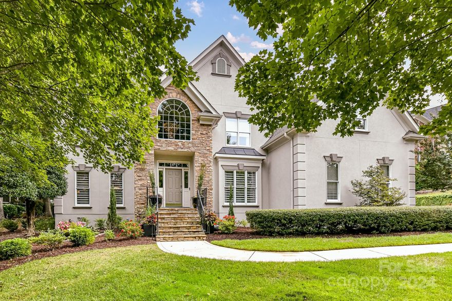 Stunning Ballantyne Country Club home situated on a Cul de sac street. Impressive foyer flooded w/natural light & fabulous RH chandelier, leads to thoughtfully designed floor plan ideal for entertaining. Convenience of dual staircases w/updated iron balusters. Gorgeous renovated kitchen w/Wolf cooktop & KitchenAid micro/oven seamlessly connects to the Great Room w/custom built-ins & vented Gas Fireplace. Screened porch w/beadboard ceiling & fan leads to spacious patio providing a natural retreat w/views of lush greenery. Office/Bedroom on 1st floor w/full bath access. Upper level features Primary suite w/tray ceiling, large bath, seamless shower, freestanding soaking tub & WIC. 3 add'l bedrooms w/large closets (most w/custom built-ins) 2 add'l baths & bonus room. Recently refinished Hardwood floors, updated lighting throughout, Custom motorized shades, recently painted interior & Ext painted 2024. Oversized 2 car garage w/work area & storage w/built-in cabinets & granite countertops!