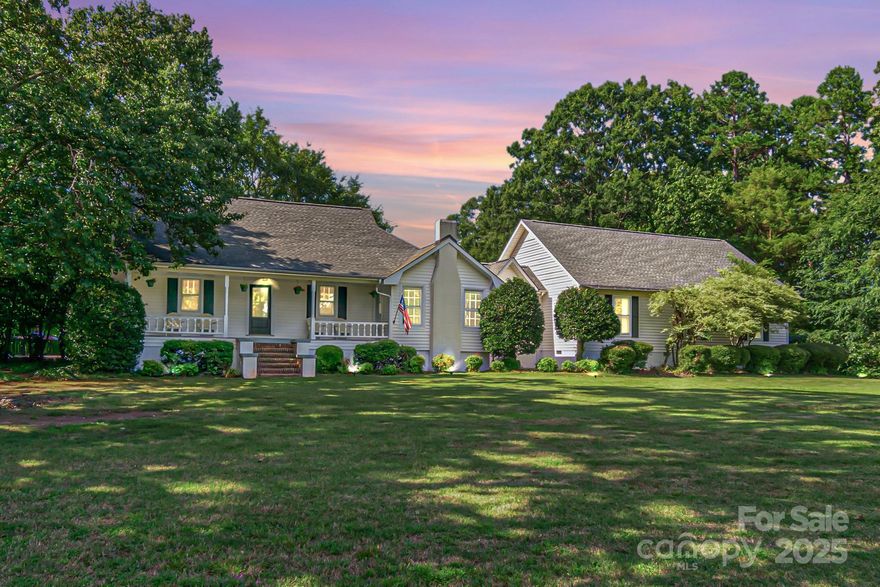 Welcome to your piece of country right in Wesley Chapel! With over 75K in Updates! Step inside to be greeted by soaring ceilings adorned with stunning, exposed wooden beams that add warmth and character to the modern interior. Your eye is drawn straight through the front door to the backyard’s mature trees, perfectly framed by a light-filled sunroom. Located off the sunroom, the kitchen has all newer appliances (2024) and a nice breakfast bar to have your morning coffee! The renovated primary suite (2025) includes a walk-in closet, dual head marble shower, Kingston Clawfoot tub, and walk-out deck that are sure to impress! With a 24X48 concrete pad (2025), you can create your own basketball/pickle ball court or dream garage! Paint throughout home (2025), new flooring in large portion of home (2025), light fixtures throughout (2025), Painted cabinets in kitchen and bathrooms (2025), new decks along the back of home (2025), Vapor barrier in Crawl space added (2025), and an Electric Fence installed (2024). This home has so much to offer! Offering a $1,000 credit to the buyer for the primary closet they want to create or the owners will add rods prior to closing! Less than 5 minutes to Wesley Chapel center, you can have historic charm and modern amenities! Both owners are real estate agents.
