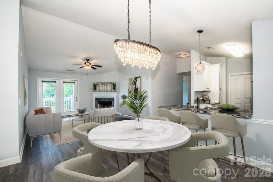 Enjoy an active, carefree lifestyle near Birkdale Village, Lake Norman boat clubs, and within the neighborhood a pool, clubhouse, and fitness center. PLUS: a bike trail and Greenway path to restaurants, shops, and entertainment! Uptown Charlotte is less than 19 miles away and the airport, less than 22. This well-located condo is move-in-ready with its Tranquility Resilient LVP flooring, designer-style lighting, high ceilings, and open floor plan. In the Kitchen is pristine-white cabinetry, striking granite counters, a breakfast bar, and SS appliances (incl the refrigerator). In the Dining Area is a fabulous chandelier and in the Great Room, a vaulted ceiling and fireplace. Outside the GR is a covered balcony with park-like view. The Primary BR has a vaulted ceiling, walk-in closet, and en suite with tiled shower. PLUS: a 2nd BR and Bathroom, dedicated Laundry Room (incl the washer and dryer), and a Flex Space/Home Office perfect for virtual meetings! The HVAC unit was replaced in 2019, water heater in 2022, and roof in 2022. HOA fees include the amenities, exterior building maintenance, lawn maintenance, and water bills. Why rent when you can buy AND enjoy an active, carefree lifestyle?