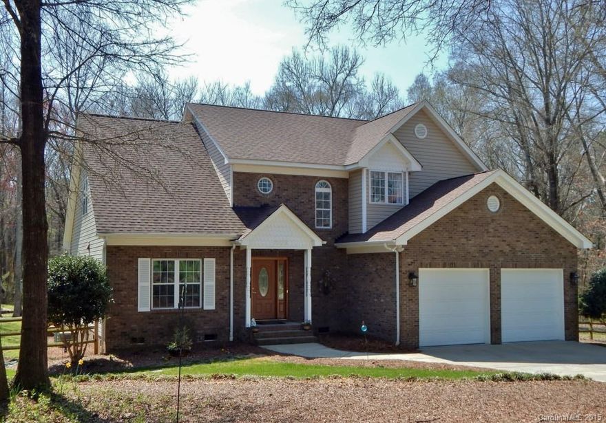 Beautiful custom built Brick & Vinyl home on 2 private acres. Cheerful transitional interior w/hardwoods on main level except Master.  Formal DR, Granite Kitchen, Sunny Breakfastroom w/French Door to Deck. Backyard is fully fenced in w/gorgeous above ground pool w/huge deck surround, storage shed, mature trees.  Enjoy the Town and Country lifestyle just minutes to Ballantyne area w/ great shops & restaurants, yet plenty of elbow room on private street.  No HOA.  New Harrisburg Elementary nearby.