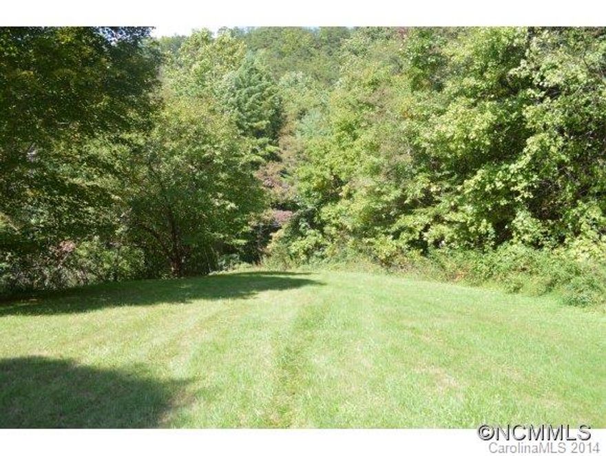 Private setting in Little East Fork community, spring with pump house in place, park your RV till you decide to build or enjoy it as is. Approx. 2 ac cleared with potential house site located at the top of the cleared area. Partially Paved Drive, Multiple building sites possible or just have your own private retreat. A portion of the property borders Little East Fork river. Excellent Trout Fishing!