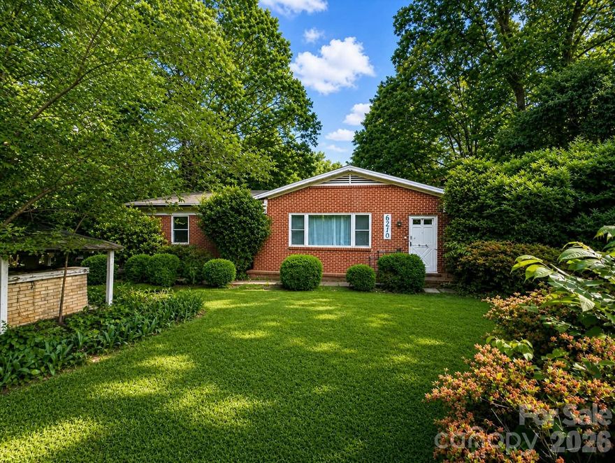 Charming brick ranch tucked away in a hidden gem of a neighborhood in East Charlotte, offering the perfect blend of privacy, character, and convenience. Surrounded by mature trees and scenic lakes, this community feels like a peaceful retreat—yet you’re still right in the heart of Charlotte.

Inside, the home features a warm, rustic-style kitchen and dining area full of character, along with beautiful original hardwood floors that add timeless appeal throughout much of the home. The inviting living room is centered around a working wood-burning fireplace, perfect for cozy evenings and adding to the home’s classic charm. The spacious laundry room offers excellent potential to be converted into a second bathroom, adding even more value and functionality.

Step outside and enjoy a generous lot with endless possibilities for outdoor living. The neighborhood truly shines with its lifestyle perks—enjoy weekend food trucks, stroll along walking trails in the neighborhood park, or relax by the serene community lakes.

This is more than just a home—it’s a chance to be part of a charming, established community that feels worlds away from the hustle, while still being close to everything Charlotte has to offer.