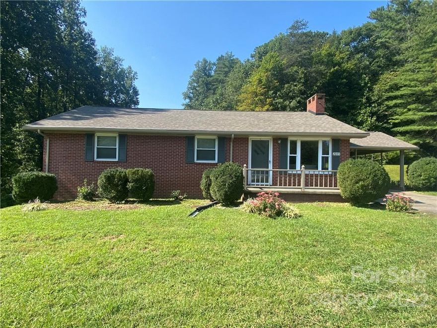 Are you looking for a home with LAND?? Just outside the city limits, you will find this charming and well-maintained  3BR/1BA home situated on 2 parcels totaling just under 10 Acres. From the adorable kitchen with a breakfast nook, you have a den/family/dining area with a brick fireplace and gas logs. Just around the corner, there's a large living area with an additional fireplace and gas logs. Down the hall, you will find 3 bedrooms and a bath. The bathroom does have double vanities so it makes sharing much easier. The bonus area downstairs has an endless array of uses from a home office, family room, home gym, crafting area, etc... Behind the home, you have a second parcel that could make an incredible home site, garden or merely just privacy which is accessible from the side road. Just minutes from dining, shopping, and entertainment. 20 mins to Blowing Rock and approximately 30 mins to Hickory.