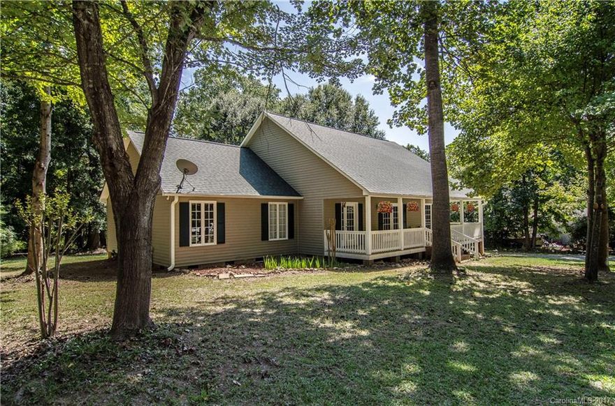 Looking for a roomy home on a large lot with no HOA? Lower South Carolina taxes? Here you go! Quiet and serene yet close to shopping and dining.  This home has a large rocking chair front porch that faces a natural area. The upper level is perfect for the work-from-home office or musician's hide-out. Newer roof, AC and hot water heater. Master down. Screened in back porch and deck faces private back yard.