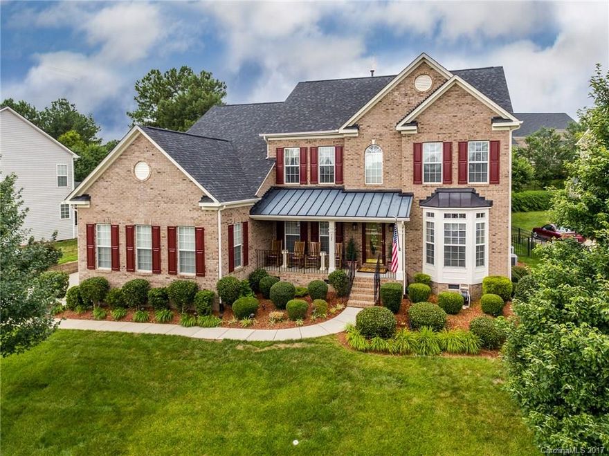 Immaculate home! Great entrance with covered Front porch. HW in Foyer, DR & Kitchen and Sun Room. Office on main level.  Master with sitting area, tray ceiling plus three other bedrooms upstairs.  Full irrigation with separate meter.  Beautiful covered patio w/natural gas hook up for grill. Private fenced back yard for entertaining.  Large 3 car garage with utility sink. Great neighborhood with community pool & play ground.   Convenient to Charlotte.  Fort Mill Schools! One owner!