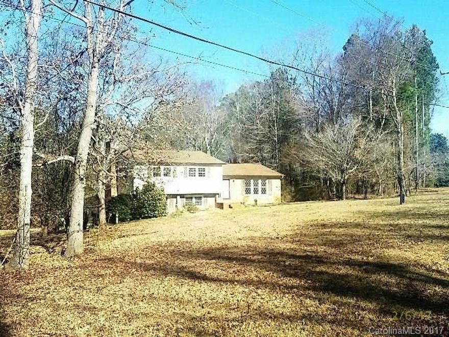 Tri-Level home nestled on a beautiful wooded lot. Tons of opportunity to make this home your own. Carpet has been removed.