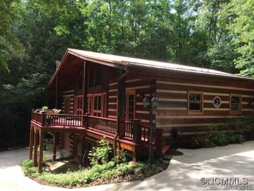 Spectacular 4 BR, 4 BA lakefront log home situated on 1.82+/- level acres overlooking beautiful Laurel Lake. Great room with massive stone fireplace overlooking the lake, beautiful wood floors, spacious master suite, and fully remodeled lower level features copper ceiling and stone fireplace. A private dock, circular concrete drive, and park-like setting make this home the perfect mountain retreat.