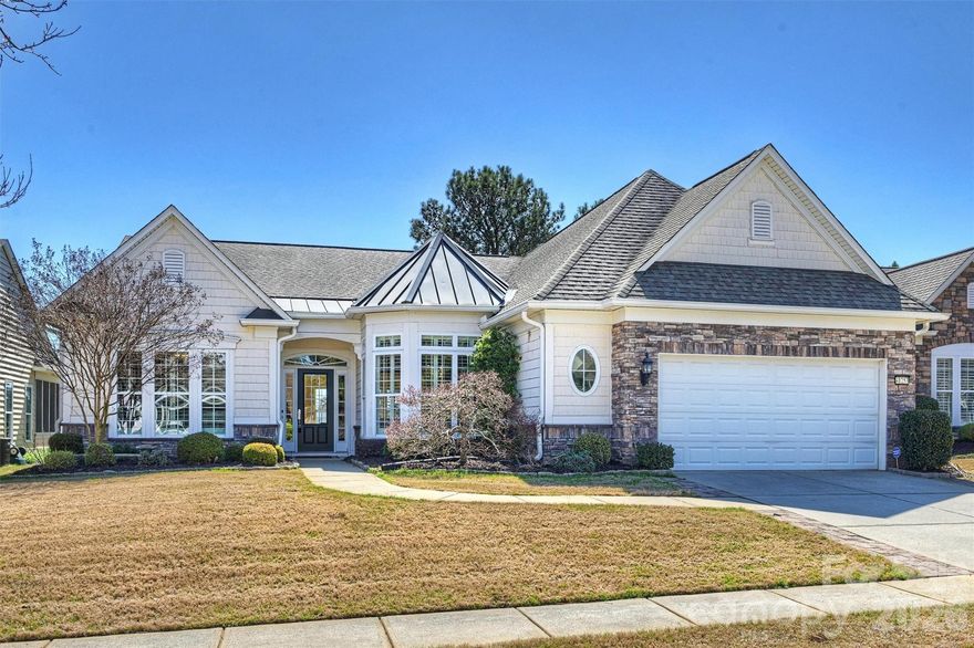 BACKUP OFFER ACCEPTED.  *SCENIC LAKE WATER, HARDWOOD TREES & 17th GOLF TEE Box!  Truly one of best views in Amenity-Rich community of Sun CiTY!  A FAVORITE: Luxury “Cumberland Hall / Manor Collection" Ranch home with SUNROOM Glassed-in.  Incredible Lake Views from Indoors: Great Room, & large Eat-in Kitchen with gorgeous Chandelier, high end Appiiances (Bosch, Thermador), loaded with Cabinet space, Island, & breakfast Bar.  New High-end Stone Countertops & Tile Backsplashes, modern faucet, & under cabinet lighting.  Renovated Bathrooms.  Large Luxury primary Shower & new lg Closet System.  Open FloorPlan w/ Plantation Shutters, Hardwood Floors, Gas Fireplace, Ceiling Fans, Mini-Split system in Sunroom, Laundry Rm w/ Cabinetry & big deep sink.  Library, Office, Sunroom, 3 Bdrms, 3 Baths.  Irrigation system. Extra work space in Garage. Transferrable Termite Bond.  Aesthetically pleasing Rock Sculpture Water Fountain adorns new large paver Patio.  Watch Golfers tee off while sipping & dining from your Paved Patio under the Electric Shade Awnings.  

Two CLUBHOUSES/Fitness/ KAYAK Ctr/ Catawba River/GOLF/TENNIS-Pickle Ball-Bocce Ball/WoodWorking Shop/Indoor-Outdoor POOLS/ PARTIES/ CLASSES/ CLUBS/ Fishing/& Ballfields.  Shopping & MEDICAL very close-by. Target, Costco, Library, Harris Teeter Grocery, Publix, TJ Maxx, Home Goods, Hobby Lobby, Aldi, & many Restaurants & Entertainment.  (Pictures taken in the Winter Season).   MULTIPLE OFFERS WERE RECEIVED.