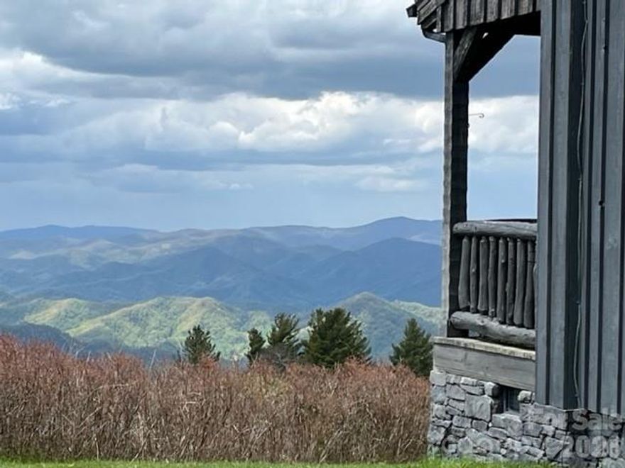 Looking for a mountain home that feels worlds away yet is built to stand the test of time? This handcrafted log retreat offers just that. Perched on a windswept bald a mile above sea level, it’s rare to find a home available at this elevation with such enduring craftsmanship. Enjoy breathtaking views of Mount Mitchell, the Smokies, and Pisgah National Forest—every window frames a postcard-worthy scene. Built in 2007 with 8-inch oak logs, hand-hewn details, and a red cedar exterior topped with a Gerard stone-coated steel roof, this home is made to last. Inside, Carlisle wide-plank walnut flooring, custom walnut doors, and a library with built-in bookcases and a secret door showcase the quality throughout. Located on 1,000 acres of gated wilderness, the property offers complete privacy and 360° mountain views. It’s not suburbia—it’s a place to unplug, recharge, and embrace the beauty of nature.