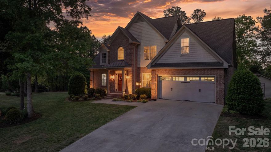 Welcome home to this stunning all-brick residence nestled in the highly sought-after Doe Run subdivision of Granite Falls, where charm, craftsmanship, and convenience meet on half an acre of beautifully wooded property. Mature trees frame the lot, offering a peaceful, picturesque setting and a serene backdrop you'll enjoy year-round. Even better, this home is part of a waterfront community with boating access, giving you the lake lifestyle without the lake price tag and best of all, there is NO HOA.

Step inside to discover real hardwood floors flowing throughout, with tile,  a cozy gas fireplace anchoring the living room, and custom ceiling speakers built right into the living space,  perfect for entertaining or relaxing at home. Thoughtful main-level living offers a spacious primary suite, convenient main-floor laundry, and a layout that lives easy for everyday life. Upstairs you'll find the additional bedrooms along with a versatile bonus room ideal for a media space, home office, playroom, or guest retreat. With three bedrooms, two and a half bathrooms, and a two-car garage, this home strikes the perfect balance of comfort and functionality.

The outdoor living is truly the showstopper. Step from the back deck into your fully fenced pool area featuring a custom inground pool, pool liner replaced approximately four years ago (2022) and pool pump replaced roughly three to four years ago (2022–2023) designed for summers full of memories with family and friends.

This home has been impeccably maintained with major-ticket items already taken care of: both heat pumps were replaced in 2025 (a $19,000 investment), the garage door motor was upgraded in 2024 and includes smart-home technology that allows you to open your garage and view a live camera feed straight from your phone, and the home is protected by an alarm system for added peace of mind. The crawl space foundation rounds out a property that has been thoughtfully cared for inside and out.

All-brick construction, an acre, custom pool, mature trees, waterfront community access, and NO HOA opportunities like this in Granite Falls do not come around often. Schedule your private tour today.