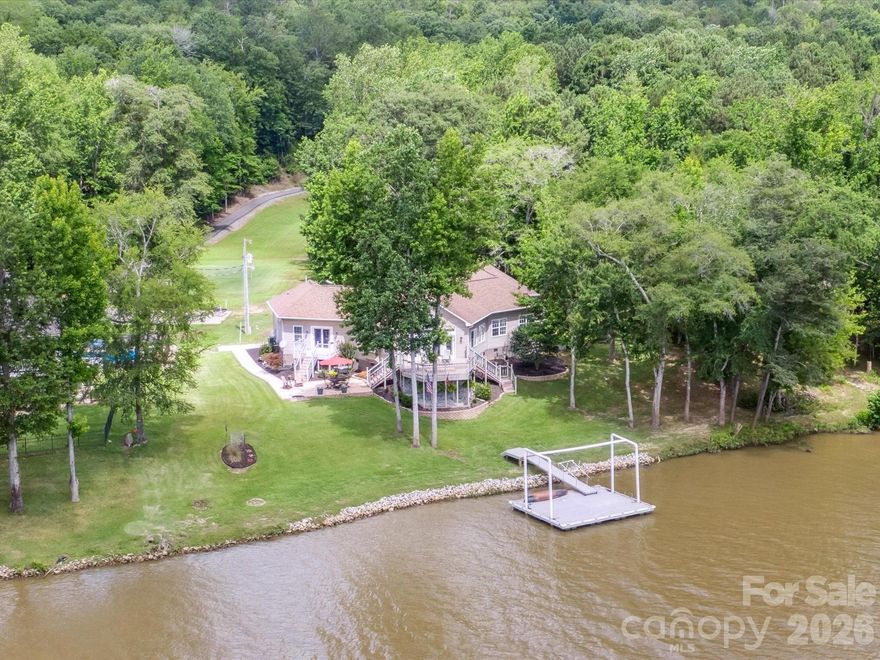 Boasting 145 feet of pristine shoreline, this property offers panoramic water views from nearly every room—including all bedrooms and living areas. Experience lakeside living at its finest in this beautiful lakefront home, nestled on a private 1.66-acre lot with a gated entrance and circular driveway. Boasting 145 feet of pristine shoreline, this property offers panoramic water views from nearly every room—including all bedrooms and living areas. Enjoy outdoor living with a floating dock featuring composite decking, two decks, paver patio, and plenty of space to relax, entertain, or launch your kayak. Impressive interior has soaring ceilings and beams, expansive windows & new luxury vinyl plank flooring. The spacious primary retreat has views, oak built-in desk space and deck access. The heart of the home is the kitchen, complete with oak cabinetry, ample workspace, and gas range—perfect for everyday cooking and entertaining. Oversized two-car garage and new storage shed. perfect blend of privacy, space, and unbeatable lake views, this one-of-a-kind property is the ultimate escape for full-time living or a luxury weekend getaway.