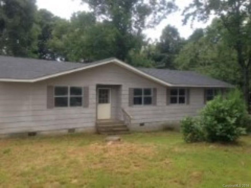 Looking for that perfect home, tucked back in the woods?  Here it is, located close to Statesville, Troutman, and Cleveland.  Partially cleaned and partially fenced. Great for a few cows or horses.  Big airy rooms, nicely set up kitchen.