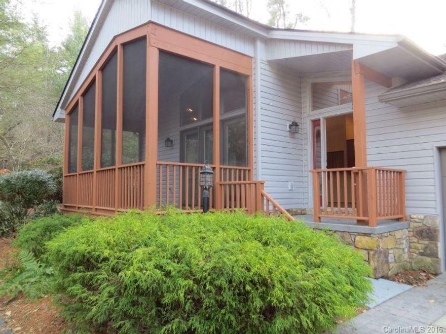 One level living with easy access to Clubhouse and all amenities. Entry opens to expansive great Room with Huge Stone Fireplace/Hardwood floors/Vaulted Ceiling/Easy access to Front Porch/Patio/Dining and Kitchen. Master Suite features large walk-in closet. Office with built-ins can easily convert to a third bedroon for overflow guests. Great for full time or vacation home. Qualla has picturesque grounds including ponds and private Ticoa Lake Dock. Buyer to pay Amenity of $8000. Two car garage!