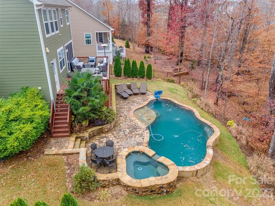 Gorgeous, highly sought after Ivy floor plan in The Retreat at Rayfield with a pool just in time for summer! This home is move in ready with all THE THINGS! Brand new true hardwood floors all throughout the first floor, and carried up the stairs to the primary bedroom. Entertain in your completely redone gourmet kitchen with marble countertops, 5-burn stove, and all stainless appliances. Wonderful open floor plan, that easily carries your entertaining outside with a screened porch, and a huge deck, overlooking a gunite heated pool and hot tub. Home has a fenced yard, included an in-ground fence for the smaller dogs. Brand new HVAC installed in 2021. Upstairs in the primary you'll find a true retreat with sitting area and your own private fire place, you'll never want to leave home.