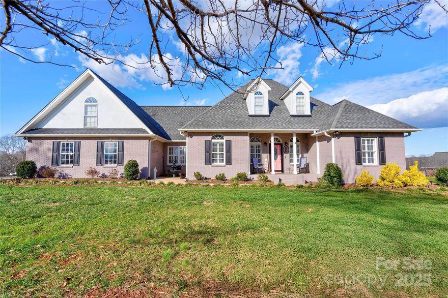 This 3-bedroom, 2.5-bath home is situated on 1.16 acres in a picturesque country setting. The property features brick and stucco accents, and the interior boasts hardwood, LVP, and tile flooring throughout. It includes a cozy fireplace with gas logs, a recently updated kitchen with granite countertops and stainless steel appliances, and a washer/dryer set that stays. The oversized garage offers ample storage and a large workshop. Enjoy the outdoors on the covered rear porch overlooking the beautiful fenced inground pool.