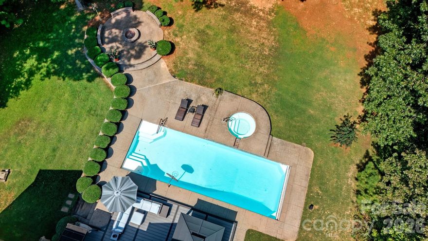 Once you reach the end of the cul de sac, you will see the beginning of the driveway of this nearly 3 acre private estate, you will know this home is the one. Meandering down the drive, through the beautiful trees, your new home appears. You will immediately notice the oversized 3 car side load garage with extended parking. The extended driveway was laid with the option of placing a building atop it. Think tiny home or mother in law suite, whatever you may dream. 
Once inside you will see fresh paint throughout, newly refinished hardwoods, new carpet and more. The 2 story family rooms is truly the center of the home & is eye-catching. Flanking this room is the grand kitchen with a dreamy pantry, storage galore along with an eat in breakfast area featuring custom built ins. 
Conveniently on the main is the primary suite with a trey ceiling, en suite, walk in closet and displays a beautiful view of the side yard and adjacent natural area. The glamorous dining room, dedicated living room/office, large laundry & a powder room complete the first floor. 
Whether you choose to tour up or down stairs, you will be pleased. The second level of Longleaf displays a whimsical cat walk with loft. On this end, there is an immensely sized bonus/bedroom, bedroom number 3 and a hall bathroom. The other wing features two more bedrooms with a dual access bathroom. This could very easily be an additional primary suite. Plenty of room for many needs. 
Speaking of room! The fully finished basement provides 2 additional supremely large living spaces, a full bathroom, another "bedroom" and storage of which fantasies occur. Also of note is a preemptive top of the line radon mitigation system installed for peace of mind.
We did not even mention outside yet! Truly this property is phenomenal. Be prepared to enjoy a rare, heated (new) inground saltwater swimming pool with waterfall jetted spa. The yard is fenced and provides a perfect combination of woods and open areas. The side yard is park like and abuts a natural area filled with trails, creeks  & nature. There are no mandatory HOA fees and are zoned for award-winning Weddington schools.
See you soon.