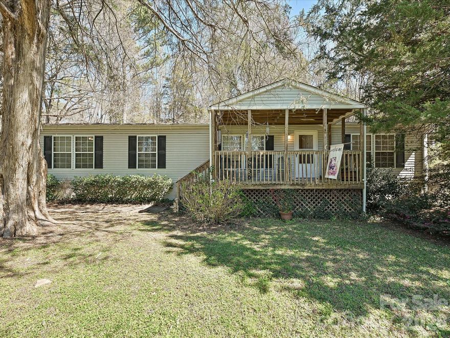 Nestled on over an acre, this charming 3-bedroom, 2-bath home offers the perfect blend of privacy and convenience. Surrounded by a wooded setting, the property provides a peaceful retreat while still being just minutes from shopping, dining, and Ballantyne!
Inside, you’ll find a functional layout featuring a dedicated office space and a heated and cooled sun porch—ideal for year-round enjoyment. The home offers comfortable living with flexible spaces to fit your needs.
Outside, the expansive lot includes multiple outbuildings, providing excellent storage, workshop potential, or hobby space, along with a convenient carport. With its private setting and prime location, this property is a rare find with endless possibilities.