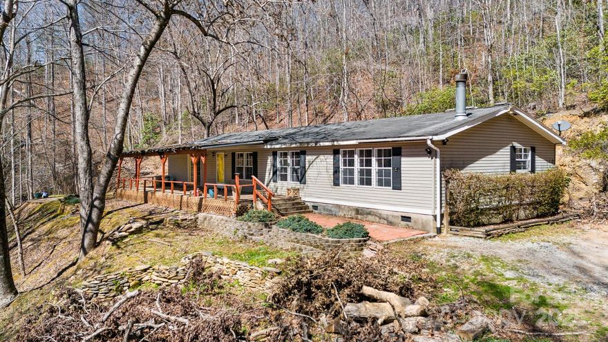 Huge Price Drop!! Welcome to your serene retreat! This charming 3 bed/2 bath manufactured home is nestled on a generous 3.45 acre wooded lot. Built-in shelving in the main room help make this open floorplan layout even more vast! As you pull in the driveway, it feels like you are far away from everything, yet you are a stones throw from picturesque Catawba Falls State Park, Old Fort's recreational pool and Lindley Park! Surrounded by nature's tranquility, this gently sloping wooded property offers a perfect blend of privacy and accessibility. Enjoy the convenience of being close to downtown Old Fort, where you can explore quaint shops, local dining, coffee shops and breweries. This property is perfect for those seeking a peaceful lifestyle without straying too far from amenities. A small landslide occurred to the right of the house taking out part of the parking area but not affecting the house. The driveway is a bit rough due to Helene, currently requiring 4WD/AWD to navigate. Easy access to I40! There is a 10 day upset period.