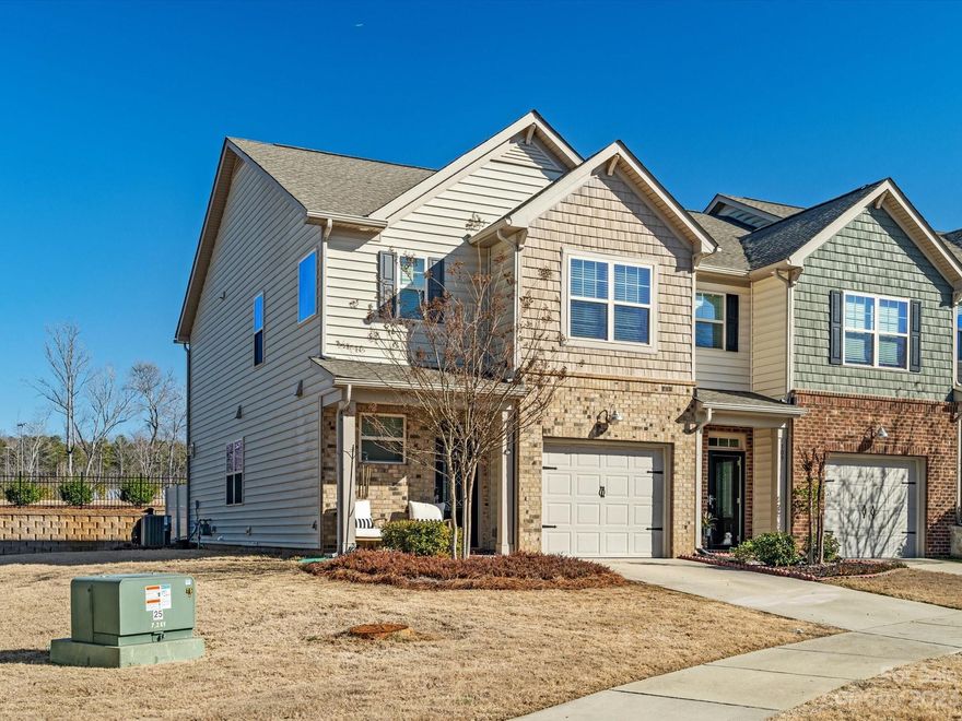 Check out this charming end unit townhouse located in the highly sought-after community of Waterside at the Catawba. Offering a perfect blend of style, comfort, & convenience. Featuring a well-designed layout that maximizes space & natural light. The kitchen boasts stainless steel appliances, subway tile backsplash, a gas range, & elegant granite countertops. Whether you're hosting a casual dinner party or preparing a gourmet meal for loved ones, this kitchen has everything you need to make cooking a breeze. The primary bedroom is a true oasis, featuring a trey ceiling that adds an extra touch of elegance. The large primary bath offers dual vanities, a luxurious soaking tub, &  a separate shower. Outside, the paver back patio is fenced for privacy, making it the perfect spot for outdoor entertaining or enjoying a peaceful morning coffee. Community features resort-style amenities: clubhouse w/ fitness center, tennis courts, basketball courts, pool, & more. Top-rated Fort Mill Schools.