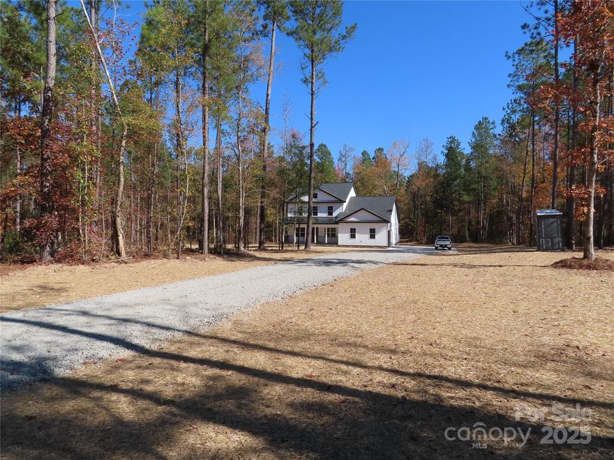 Quiet countryside but Located only a few miles to I-77 & sitting cozy on 9.26 acres, this new construction home has been completed and is ready for occupancy. Numerous upgrades  electric fireplace, shiplap accents, plenty of moldings, oversized closets, task lighting under kitchen cabinets, front and back porches. Upstairs has 2 bonus rooms. One is around 400 ft and would make a great rec room or Theater room. all 4 of the bedrooms are a nice size. Enjoy a relaxing walk through the scenic woods. Even watch the deer walk by.