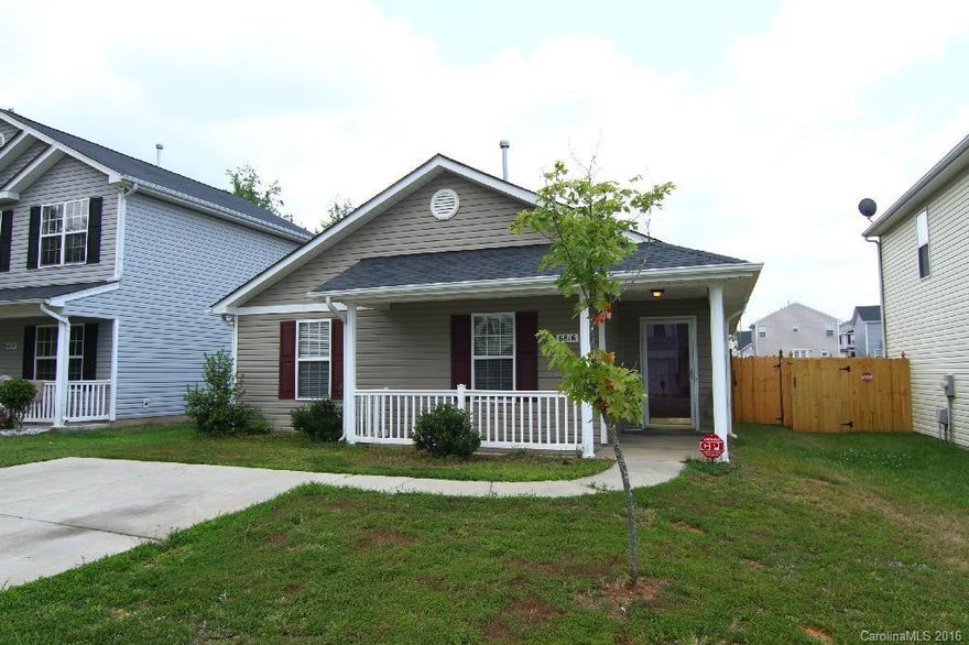 This immaculate 3-bedroom, 2-bath bungalow has a privacy-fenced backyard and security system. Quality features include a breakfast bar and large tile flooring in the kitchen, vaulted ceilings in the great room and master suite, and a dual-sink vanity in the private bath. The home is like new and completely updated with new ceiling fans, light fixtures and fresh paint. Relax outdoors on the quaint, covered front porch or patio. Close to Charlotte and Northlake Mall.