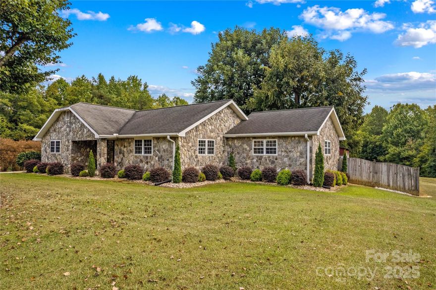 Well-maintained 3-bedroom, 2-bath home in the heart of Faith. This home boasts a striking stone exterior and multiple outbuildings. The property is fenced and includes a detached 2-car garage with workshop, a barn with stalls for the option of hobby farming and an additional outbuilding for storage. Inside, the spacious updated kitchen is a chef’s delight, featuring granite and stainless appliances, abundant cabinetry, generous counter space, and a large island perfect for entertaining or casual meals. Open layout is great for entertaining or for gathering the family together. Cozy bonus room overlooking back patio presents many options:  office, dining, sitting room, or craft area...use your imagination! Large bedrooms and updated bathrooms with modern finishes make for stylish comfort and convenience.  Step outside to enjoy the peaceful surroundings from your front porch or unwind on the private patio. Whether you're seeking tranquility, functionality, or room to grow, this home delivers it all.