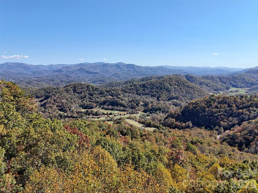 What an incredible opportunity to build in the UNRESTRICTED community of Indian Trail off of Conley Creek Rd. Great lot for primary or second home, short term rental business, vacation rental, or off grid living.  This lot offers a roughed in driveway, cleared area for building, magnificent year round views with minimum clearing, access to electricity along road,3 bedroom expired septic permit, and a gravity-fed spring already connected to the lot. There is a 1200 gallon reservoir tank on the connecting lot. Indian Trail has electric throughout, paved roads in most of community, never ending views of the surrounding mountains, and a blend of successful short-term rentals and part-time and full-time residents. Come envision your mountain home looking out at the expansive peaks of Soco gap, Cherokee, Richland Balsam, Waterrock Knob, and Cullowhee. Combine this with lot 6 next door for added privacy and even better views. 

*Drone Long range mountain view photos were taken 7 ft above the level area for accurate possible views from a home. Panoramic video from williamson road (above lots) in links.

Seller is also offering this as a leased lot. Call agent if interested.