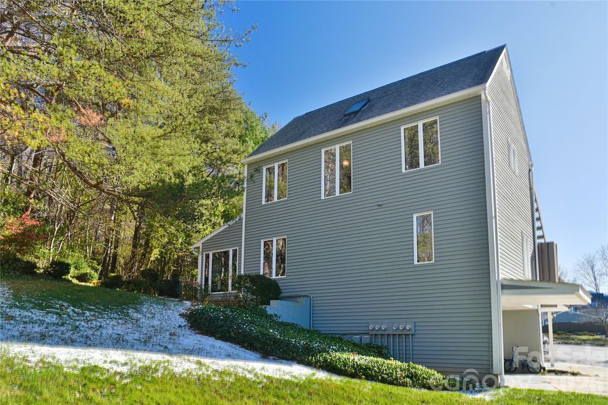 MOTIVATED SELLERS. A Sunlit Corner Retreat in The Lynx – Wrapped in Woods, Light, and Mountain Views! Tucked into a quiet corner of the beloved Lynx Condominiums, this 3-bedroom, 2.5-bath condo nestles among the trees, where sunlight pours through tall windows and mountain breezes drift across the porch. Just minutes from downtown Black Mountain and the peaceful path around Lake Tomahawk, this home offers the rare blend of maintenance-free living with the soul of a woodland retreat. Inside, the rooms feel softened by light—cascading through oversized windows and gathering in the bright 3-season room, where the boundaries between indoors and nature blur. The thoughtful galley kitchen anchors the home, while the ground-level bedroom provides comfort and ease with its own bath, stand-up shower, and nearby laundry. Upstairs, the primary bedroom opens to quiet mountain views—a gentle reminder each morning that you are living in the embrace of the Blue Ridge. Step onto the mid-level porch to linger in the sun, surrounded by treetops and birdsong. A peaceful back patio extends the living space, perfect for slow evenings or quiet conversation. With 2-car covered parking and a storage closet in the carport for all the extras—bikes, gear, and seasonal items—life here feels effortless. The community itself is warm and welcoming, where neighbors wave from their porches and summer afternoons are best spent at the community pool just a short walk away. With the Black Mountain Golf Course steps from your door and the ease of low-maintenance living, this is a place where lifestyle and location come together beautifully.
Whether you seek a serene primary residence or a thoughtfully located second home, this corner retreat offers both belonging and escape. And for added peace of mind, it comes with a one-year warranty. A place to breathe. A place to settle in. A place where nature, comfort, and community meet.